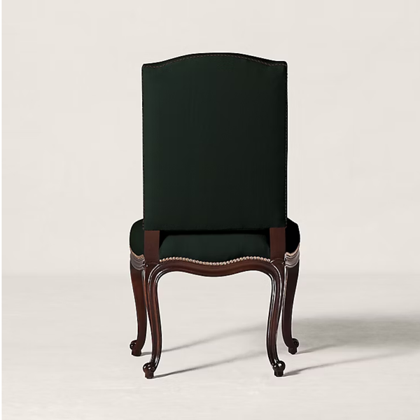 A classic high-back dining chair with a dark forest green upholstered backrest and seat, supported by curved dark brown wooden cabriole-style legs with a decorative brass nailhead trim.