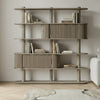 Wooden bookshelf with books in a room setting