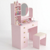 Pink children's vanity table with mirror and stool on a white background
