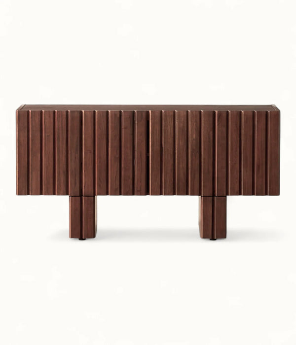 A modern wooden sideboard or console table with a dark brown finish, featuring vertical fluted paneling on the front and two blocky legs, shown against a plain white background.