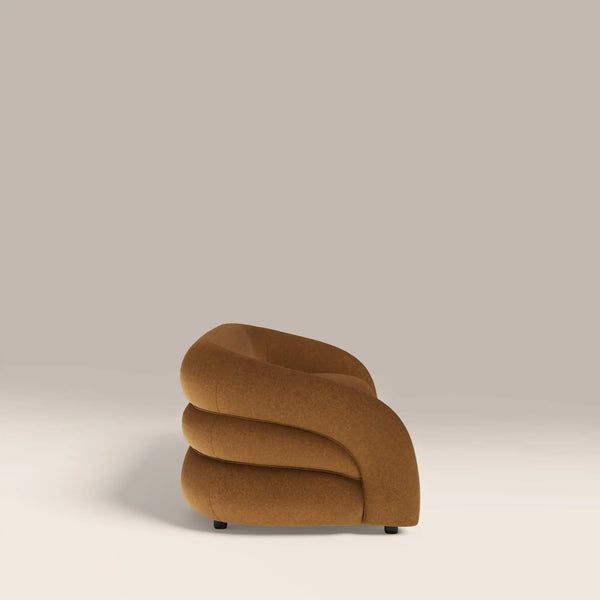 Brown curved chair on a beige background