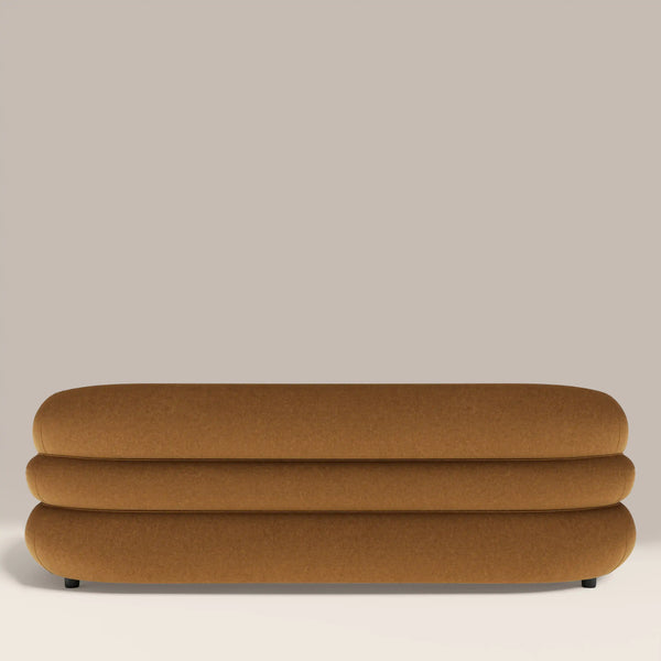 Brown ottoman on a beige background