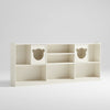 White children's bookshelf with bear face cutouts on a white background