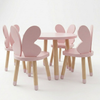 Children's table and chairs with pink bunny ears on a white background