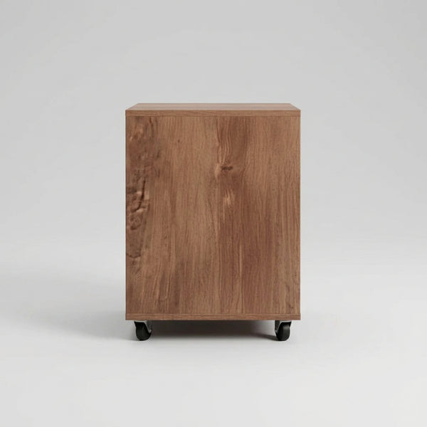 Wooden cabinet on wheels in a room with a light blue wall and wooden floor.