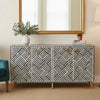 Patterned sideboard in a room with a mirror and decor items.
