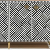 Cabinet with black and white geometric pattern and gold accents