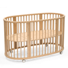 Wooden crib with wheels on a white background