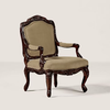 An ornate baroque-style armchair with carved dark wood and beige upholstered seat and backrest, shown on a light gray studio background.