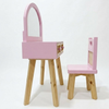 Pink children's vanity table with mirror and chair on a white background