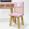 Pink children's chair with heart design on a white background