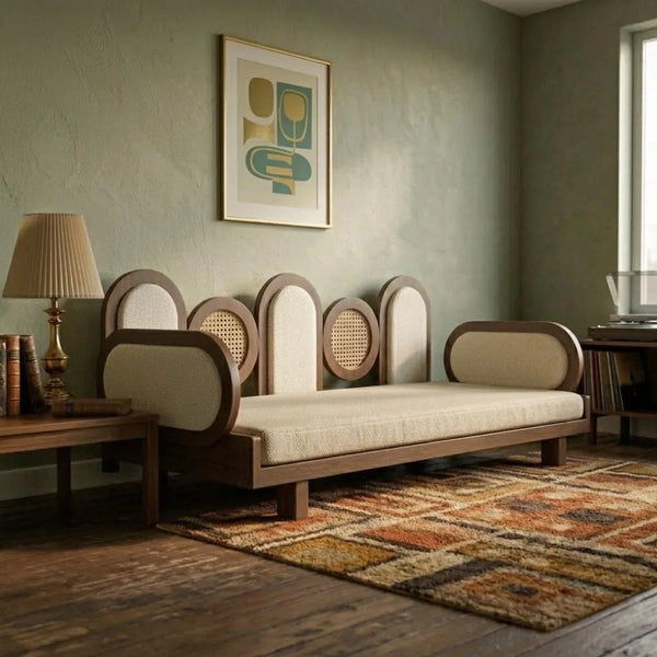 Vintage-style sofa in a room with a abstract painting on the wall and a lamp.