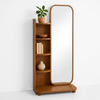 Wooden shelf with mirror and decorative items on a white background