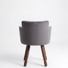 Gray velvet chair with wooden legs on a white background