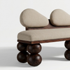 Modern bench with wooden legs and beige cushioned seats on a white background