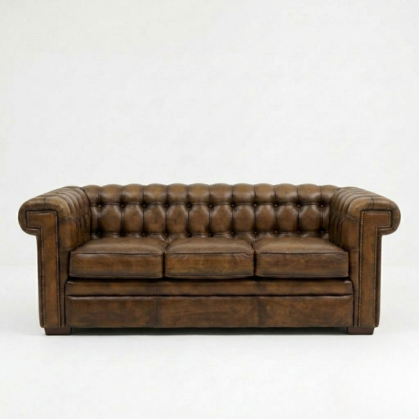 A brown leather Chesterfield loveseat sofa with deep button tufting on the backrest and arms, shown against a plain white studio background.