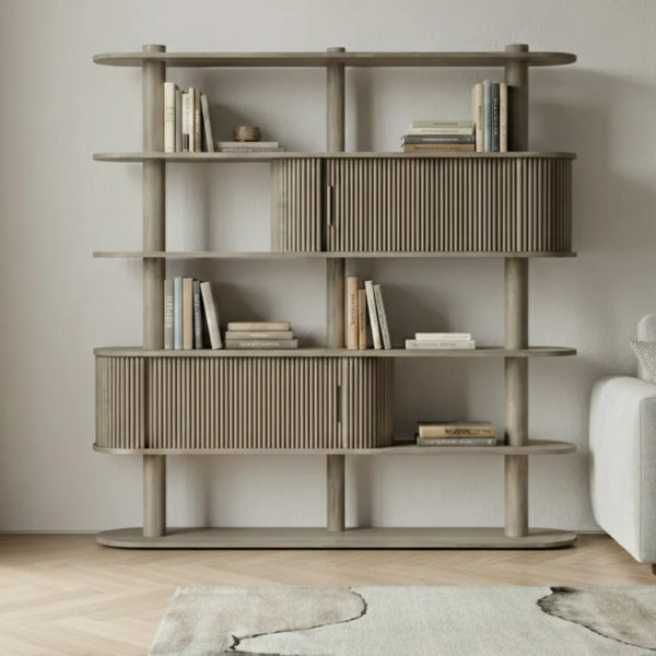 Wooden bookshelf with books in a room setting