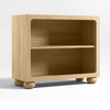 Wooden bookshelf with round legs on a white background