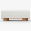 White textured bench with wooden legs on a white background
