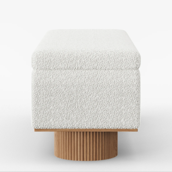 Square ottoman with white textured top and wooden base on a white background