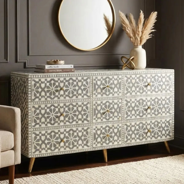 Patterned dresser in a room with a mirror and decor items.