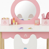 Children's pink vanity table with mirror and accessories on a white background