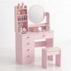 Pink children's vanity with mirror, shelves, and stool on a white background