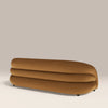 Brown curved sofa on a beige background