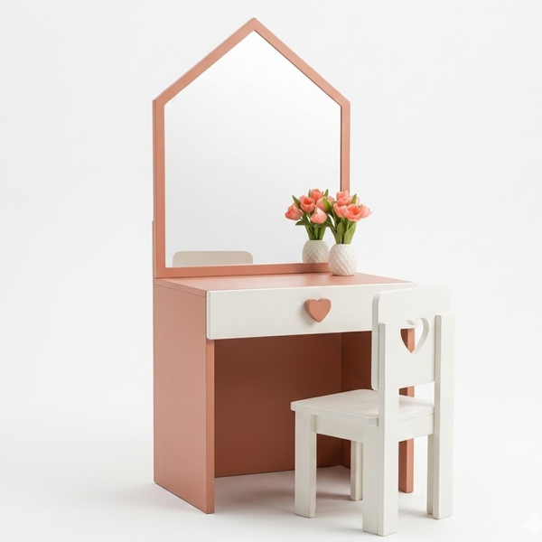 Pink vanity table with mirror and chair on a white background