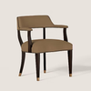 A modern accent chair with taupe-brown upholstered seat and backrest, dark wood arms and legs, and brass nailhead trim and leg caps, shown on a light beige background.