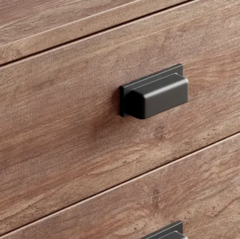 Wooden drawer with a black handle