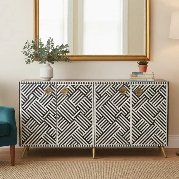 Patterned sideboard in a room with a mirror and decor items.