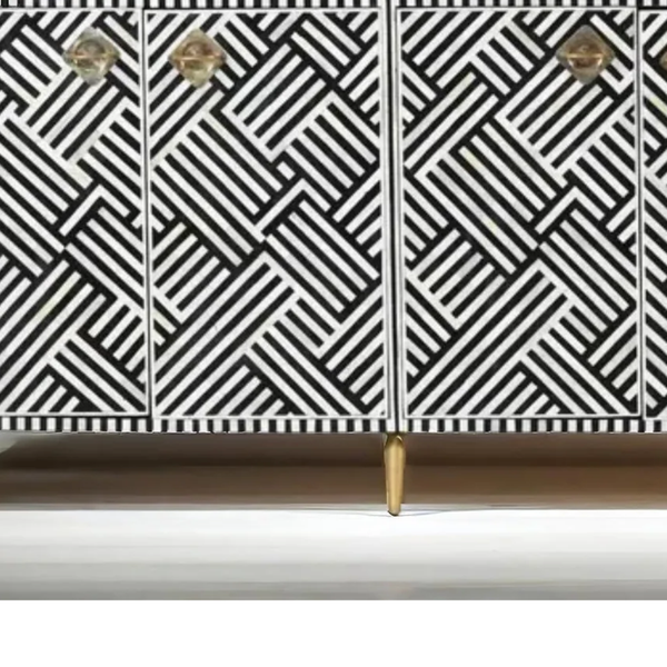 Cabinet with geometric black and white pattern and gold accents