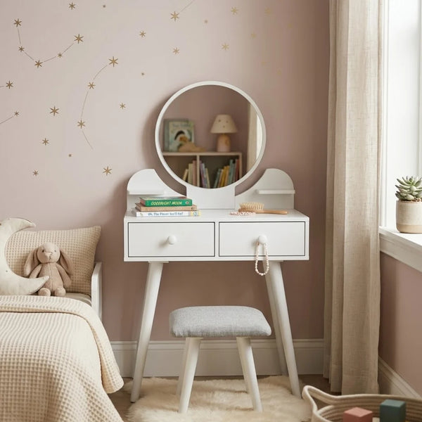 Small white vanity table with round mirror in a bedroom setting.