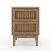 A two-drawer wooden nightstand with woven cane panels on the front of each drawer and small round brass knobs, shown against a plain white background.