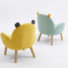 Two colorful chairs with animal-like designs on a white background