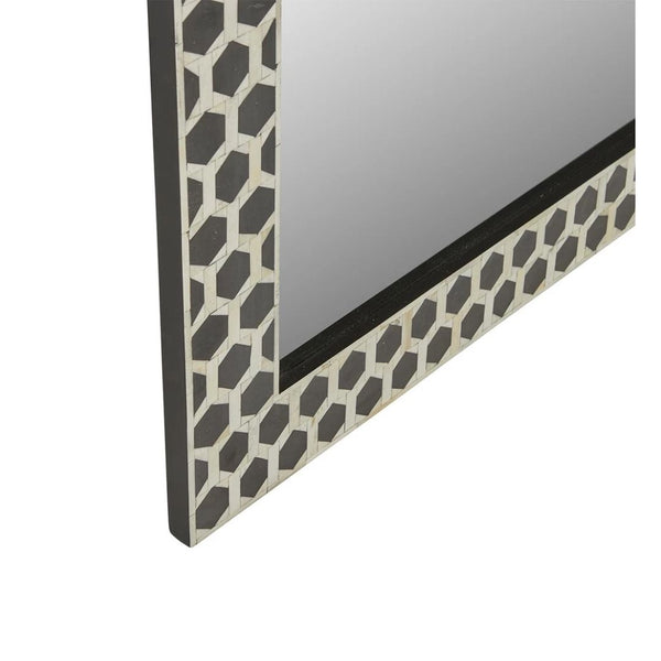 Decorative mirror with a geometric patterned frame on a white background