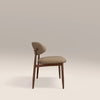 Beige chair with wooden legs on a light beige background
