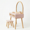 Wooden vanity table with mirror and stool on a white background