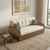 Beige sofa with wooden frame in a room with a small table and decorative pillows.