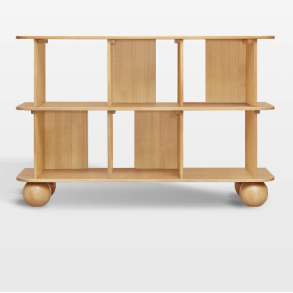 Wooden shelf with wheels on a white background