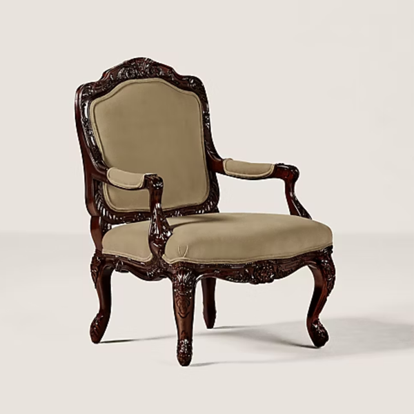 An ornate baroque-style armchair with carved dark wood and beige upholstered seat and backrest, shown on a light gray studio background.
