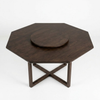 A dark brown octagonal wooden table with a round central pedestal and an X-shaped cross base, shown on a plain white studio background.