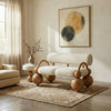Modern living room with a unique chair design featuring wooden legs and White cushioned seat.