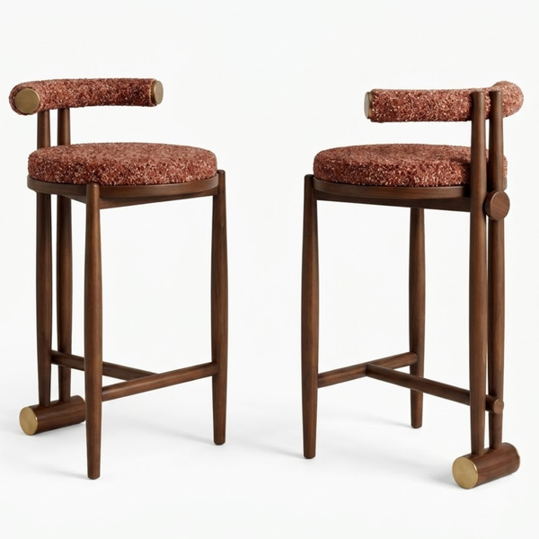 Two brown bar stools with red cushioned seats on a white background