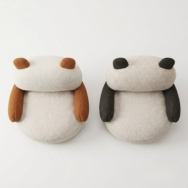 Two dog-shaped cushions with brown and black accents on a white background