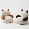Two animal-themed chairs, one resembling a bear and the other a panda, on a white background.