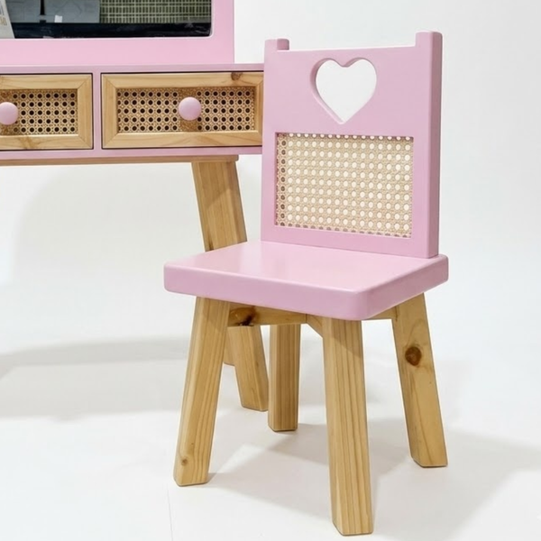 Pink children's chair with heart design on a white background