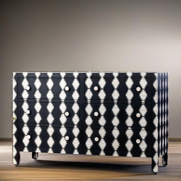 Black and white patterned dresser against a neutral wall