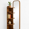 Wooden shelf with mirror on a white background